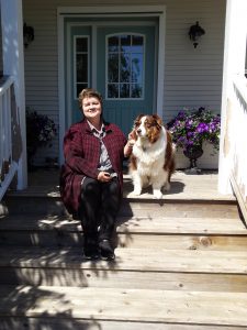 Coco the Australian Shepherd gets picked up for a grooming by Tip to Tail owner Kelly Hunt-Doherty.