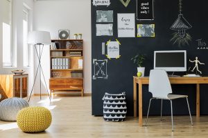 Matte black chalkboard paint in a kitchen or office is practical while also making a decorating statement.