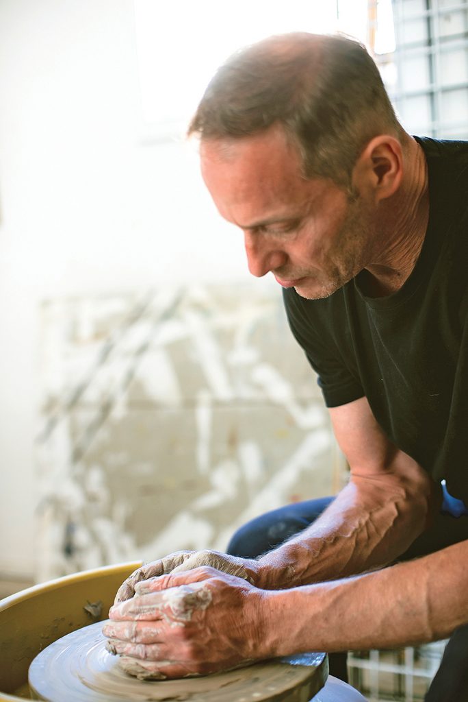 Brian Hickey takes a painting class with Jason Alexander (right), who has equipped his studio with a pottery wheel to add clay classes to his roster.