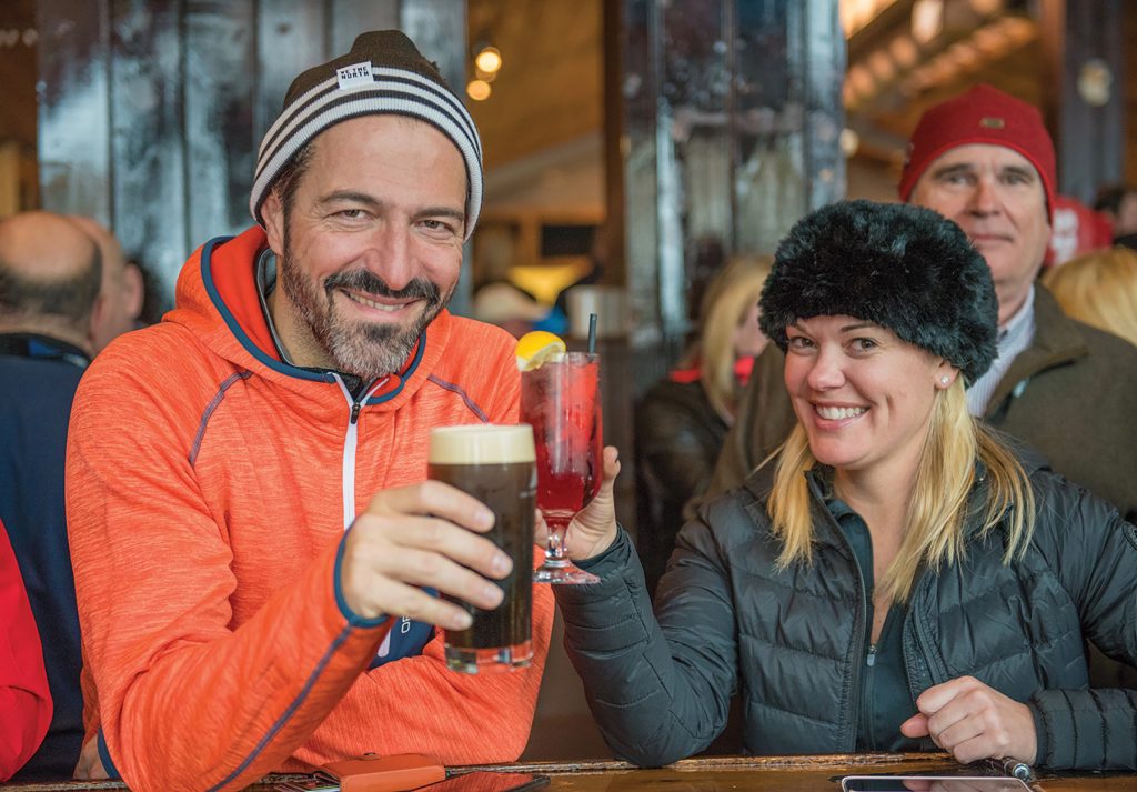 Frank Margani and Julia Hughes enjoy an après-ski beverage in the Georgian Peaks clubhouse.