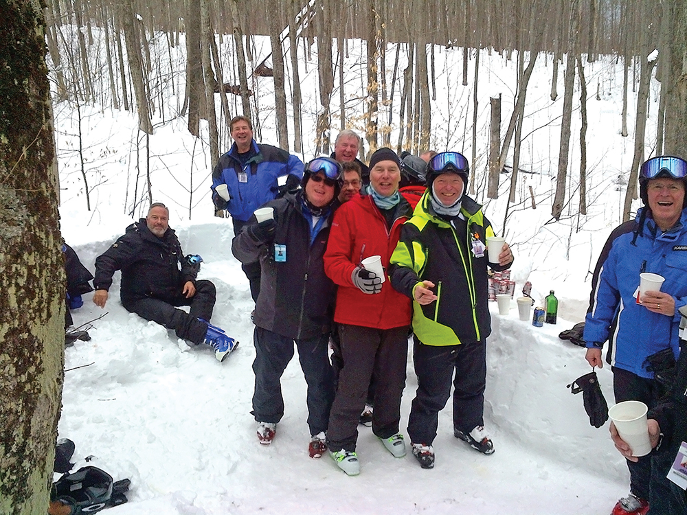 Collingwood Ski Club members enjoy Men’s Day with a beverage.