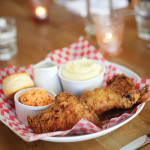 The organic fried chicken comes with a small bowl of pomme purée, a homemade biscuit and white thyme gravy.