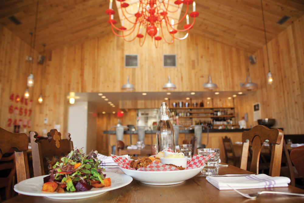 A giant bright red chandelier hangs from the raw pine-vaulted ceiling at Creemore Kitchen. The chandelier and much of the mismatched furniture has been repurposed, creating a casual, funky vibe with a touch of elegance – the perfect backdrop for CK’s scrumptious food.
