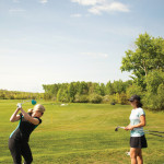 GBC member Suzanne Sutherland takes a shot while instructor Meg Chapman looks on.