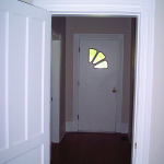 The front hallway as it is today, and as it was when the Bateses bought the house in 2006.
