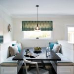 Built-in banquette seating with storage underneath creates a cosy nook for eating, doing homework or hanging out.