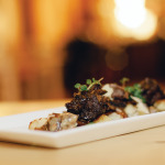Chef Justin Miller cooks these local beef short ribs for a full 24 hours in a low-heat oven and serves them with truffle oil and cheese gnocchi and a wild mushroom ragu.