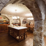 This man cave, dubbed “the grotto” by the homeowner, was designed to mimic an authentic Italian restaurant, including stone arches, vaulted ceilings, pizza oven and marble prep table.