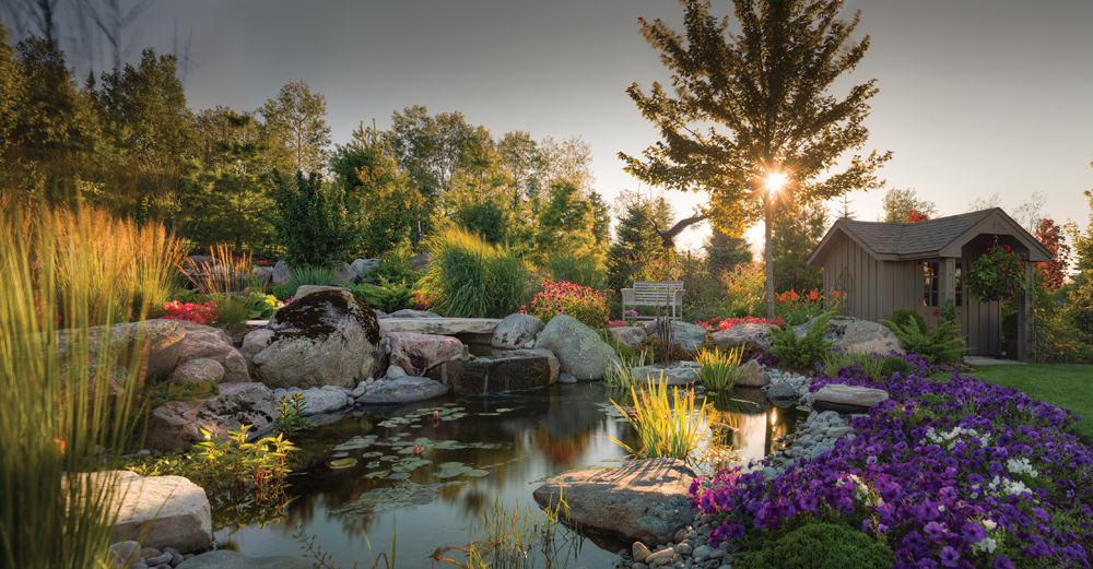 This pond and waterfall, installed by The Landmark Group, add life, serenity and the soothing sound of water to the garden.