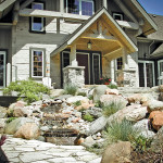A front yard can also be the setting for a water feature – in this case to mask the noise of street traffic.