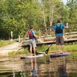 Free Spirit Tours instructor Matt Code (red life jacket), takes Joel Dawson for a leisurely paddle down the Beaver River. Locally we have a choice of rivers as well as the long, extended shoreline of Georgian Bay offering plenty of places to slide a board into the water.