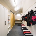 The large, well-planned mudroom was built by Ken Vogel Construction with plenty of storage and a waxing table that allows the three boys to tune their own skis.