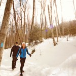 Wendy Spencer and her husband, Dan Porter, snowshoe through the trails at Devil’s Glen Country Club.
