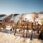 Skis and snowboards stand at the ready outside the lodge at Devil’s Glen.