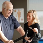 Sue Underhill of Maximum Physiotherapy (right) works with client Don Megdonal, teaching exercises and techniques he can continue at home to strengthen muscles and joints and improve range of motion.