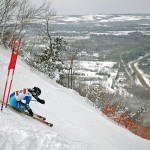 A racer plunges down the vertical at The Georgian Peaks Club. “The Peaks” is the only ski area in Ontario with enough vertical rise to hold a F.I.S. (International Ski Federation) sanctioned giant slalom race, but also offers ample intermediate and beginner slopes to accommodate all ages and abilities.