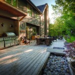 This deck by The Landmark Group blends into the natural landscape, made of western red cedar and featuring a built-in rock garden with a flagstone bridge inlay.