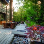 This deck by The Landmark Group blends into the natural landscape, made of western red cedar and featuring a built-in rock garden with a flagstone bridge inlay.