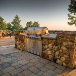The Landmark Group of Thornbury built this fully outfitted outdoor kitchen. Appliances are now designed to be left outdoors all year round. Barbecue grills built into rock-faced islands allow for generous counter space.