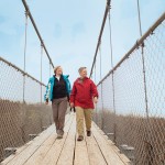 Writer Laurie Stephens (right) strolls along the suspension bridge at Scenic Caves with Karen Hall of Wasaga Beach and Toronto. The longest footbridge in Southern Ontario, it “cost $1 million to build and has million-dollar views.”