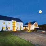 Golden interior lights, subtle mood lighting and a full moon give the Barn a glowing presence.