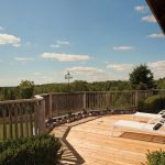 A wooden deck between the two rooftop gardens is perfect for sunbathing, or just taking in the sweeping view of the 25-acre property.