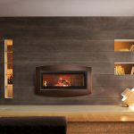 his wood-burning fireplace from Town & Country Luxury Fireplaces is the first linear wood fireplace made in North America. The optional surround, called Element, is one of three available by Piazzetta, Italy.