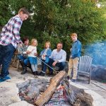 The firepit, with its circle of weathered cedar chairs, was a selling feature when Jim and Maricke Emanoilidis decided to buy this weekend home for their family. Here, they gather with Owen and Parker, 9, and Bridget and Ada, 5.