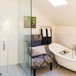 By stealing space from the adjacent bedroom, the master bath was made large enough for a glass enclosed shower and a clawfoot tub.