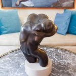 The owner also collects sculpture like this bronze on the living room coffee table.