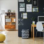 Matte black chalkboard paint in a kitchen or office is practical while also making a decorating statement.