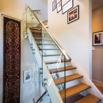 The staircase in the three-storey condo was replaced with an open floating staircase for a more contemporary look, while the former sitting area was converted to a music room featuring Somborac’s Suzuki baby grand piano.