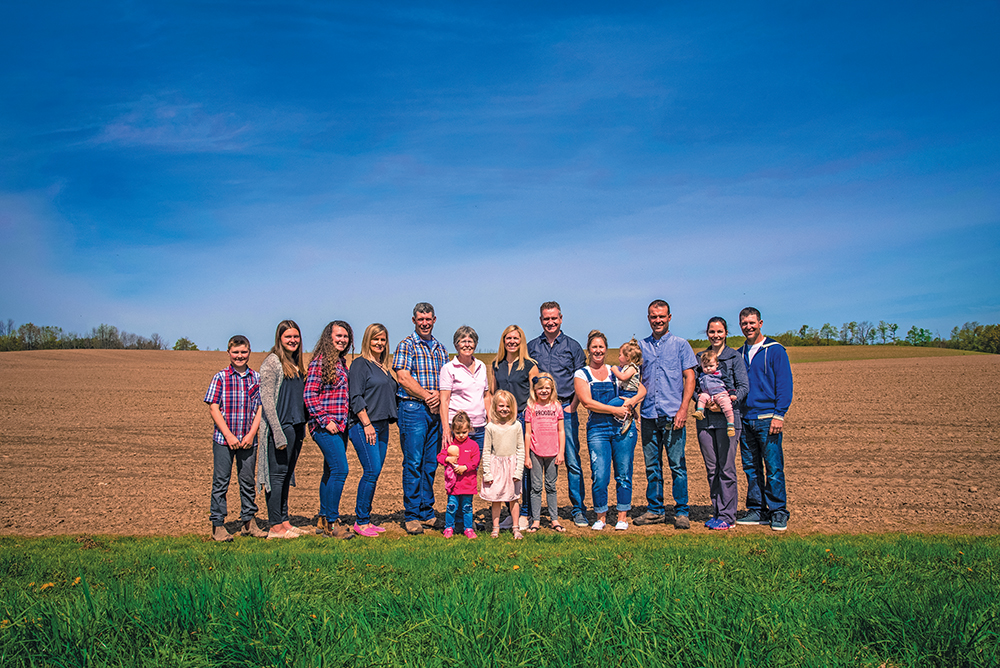 The Millsap family is still farming in the Creemore area after five generations, but it’s unclear whether the next generation will keep the farms going. The extended Millsap family, back row, l-r: Luke, Libby, Grace, Shauna, John, Gayle, Jenny, Mike, Rhonda (holding Tessa), Andrew, Leanne (holding Blake) and Brett. Front row, l-r: Avery, Sloan and Kaylan.