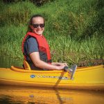 Maddie Floether takes a break from paddling the solo kayak