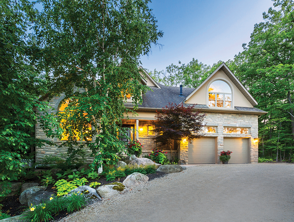 Mature trees soften the exterior of the house built in 2002 near the Craigleith Ski Club. Landscaping by The Landmark Group in Thornbury blends with the woodland setting.