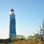 The Nottawasaga Lighthouse before it was wrapped, showing the damage that occurred after a lightning strike caused one area of the exterior wall to crumble and fall off.