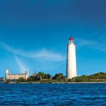 A unique image showing the Lighthouse and Terminals together, taken from a boat on the northwest side of the structures. This photo has not been manipulated; it shows the two buildings as they appear from that vantage point.