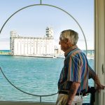 John Wiggins takes in the view of the Collingwood Terminals from his Shipyards condo.