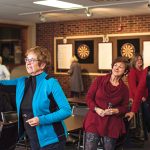 Dale Ellet-Bristow (left) takes aim at a recent Probus ladies’ dart night, while Marley Brandon (centre), Pat Carr (right) look on.