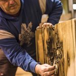 Sam Karn of Country Charm shows the craftsmanship that goes into choosing and finishing live edge slabs to create furniture that makes a statement.