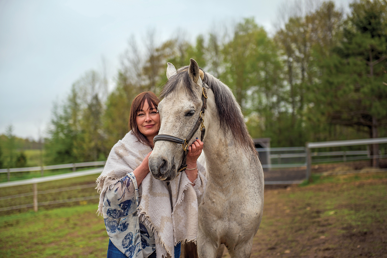 Denice Muzzatti, a registered psychotherapist and certified FEEL practitioner, with Cav the horse.