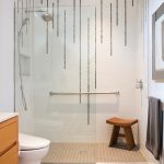 mosaic tile creates a ‘waterfall’ pattern in the master bath shower.