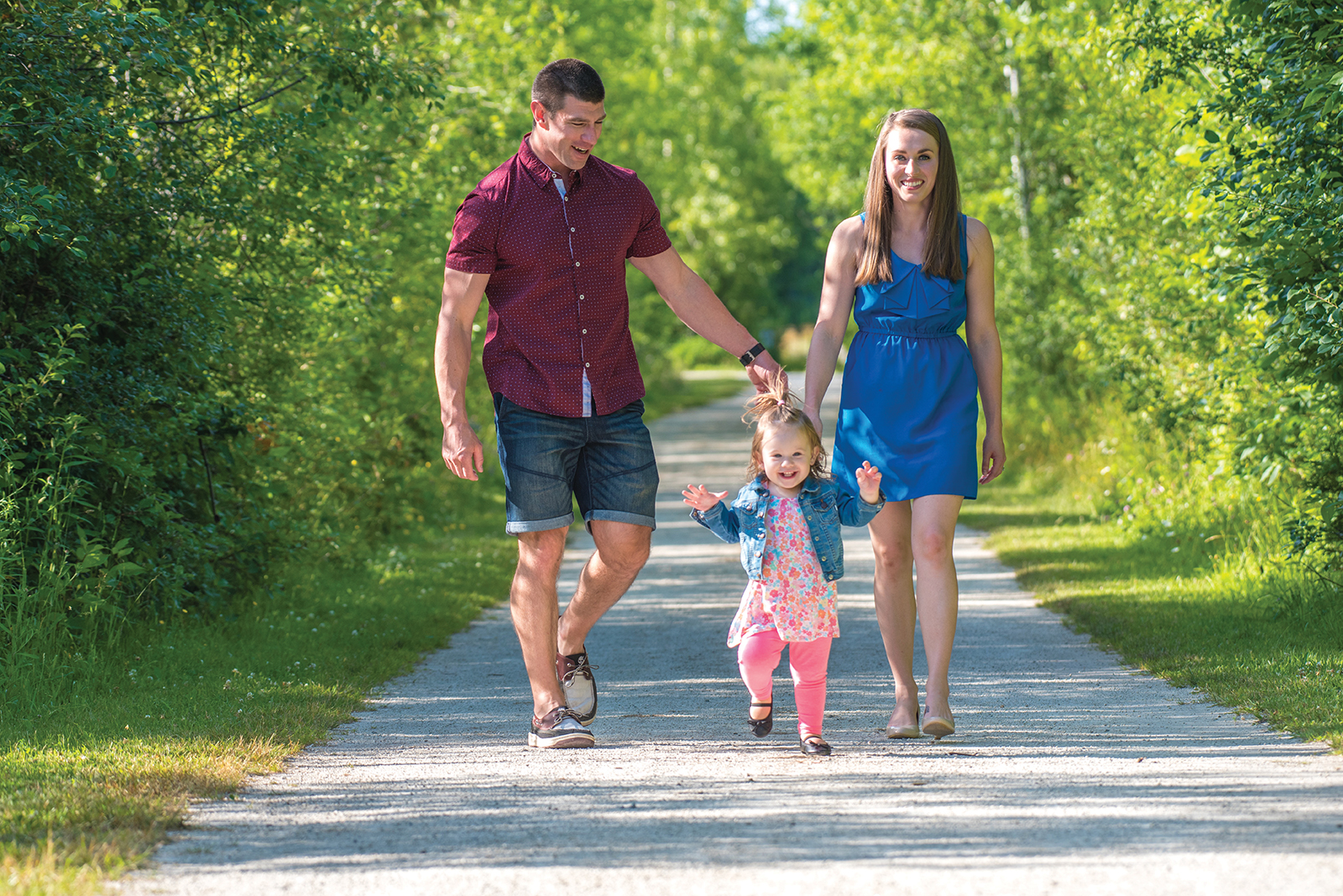 Jonas and Hilary Deline take their daughter Stella on a family walk along the Georgian Trail.