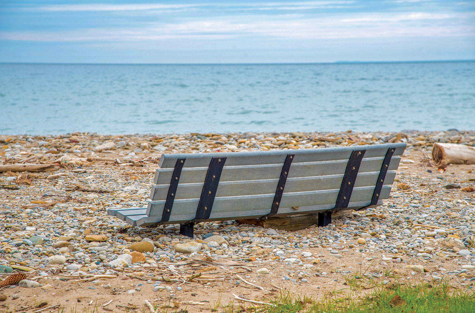 A partially buried bench at Fred Raper Park in Meaford.