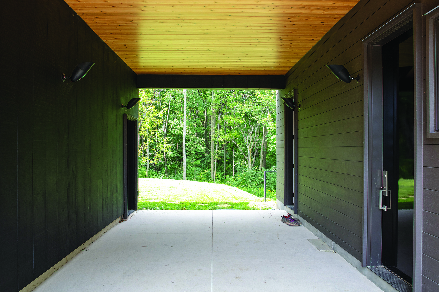 A breezeway separates the garage at left with the house at right.