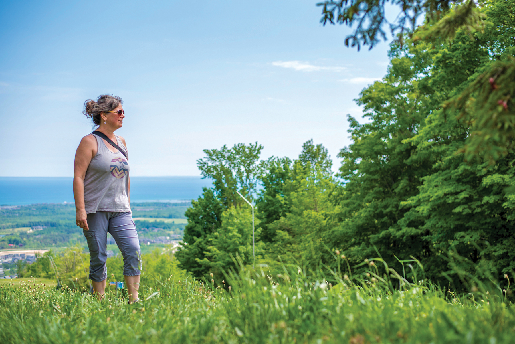 Susan Brindisi enjoys the view from the top of The Grind trail at Blue Mountain Resort