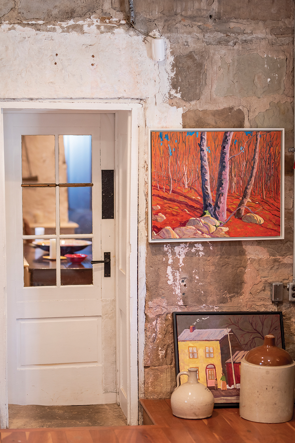 Two of Bill Franks’ paintings are right at home against a rustic farmhouse wall.