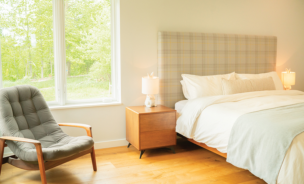Bedroom: The custom headboard designed and upholstered in Paul Smith plaid wool, by Bouj.