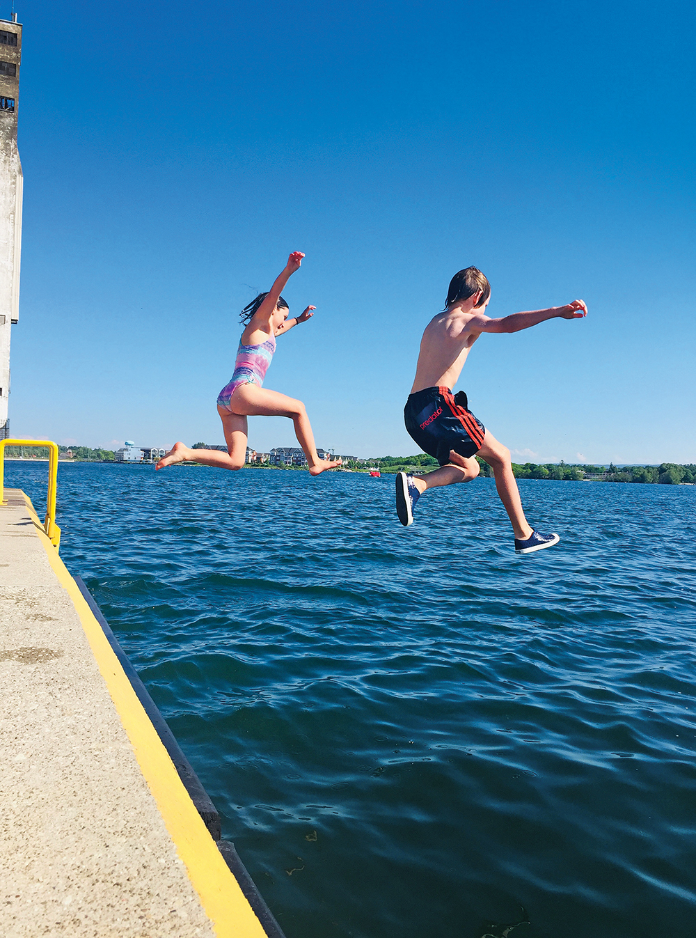Ayla Zavitz and Hugo Meiche enjoying the rites of summer at Collingwood Harbour.