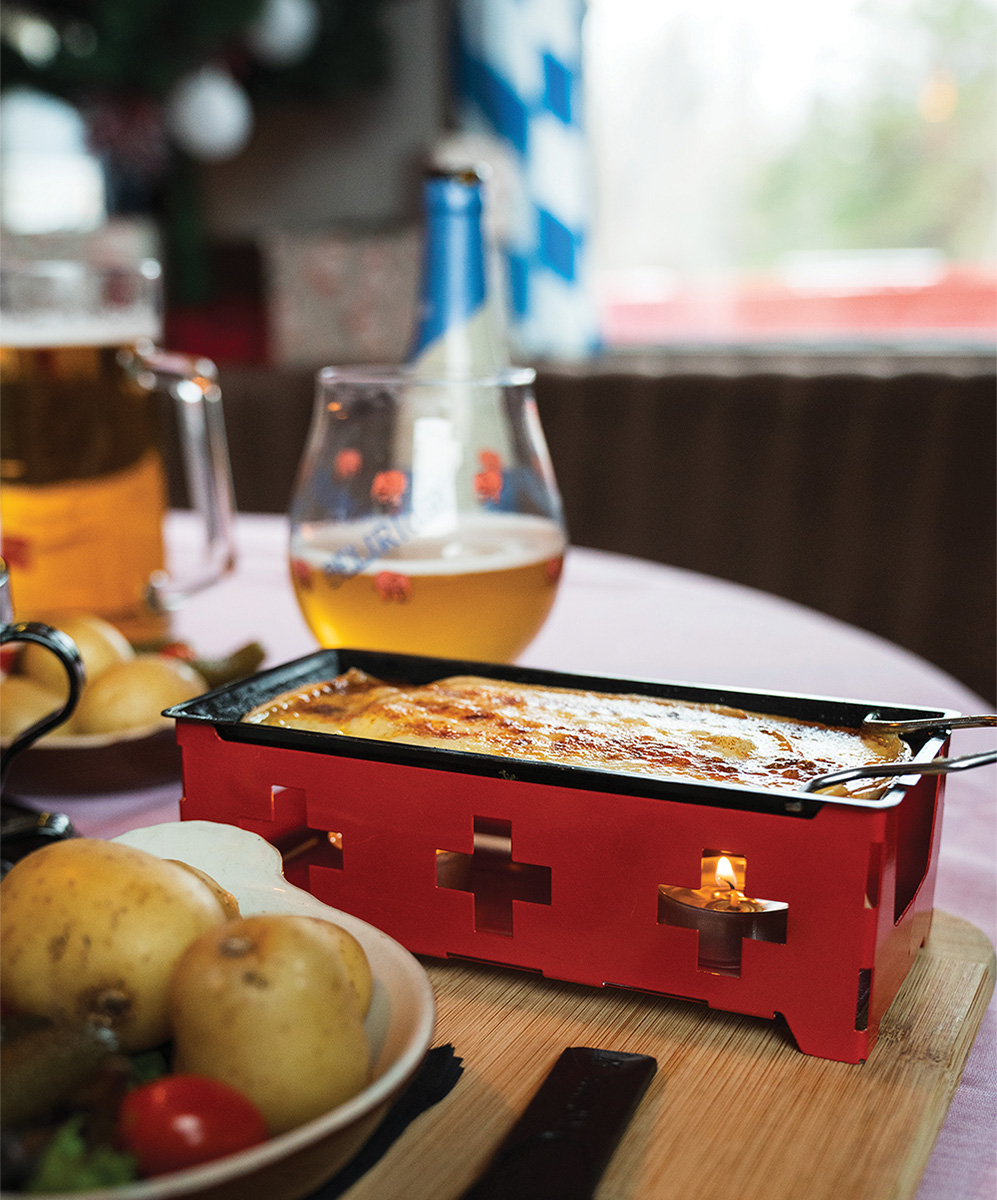 The Alphorn restaurant serves up traditional Swiss Raclette and sides, and Stiegl on tap. Proscht!